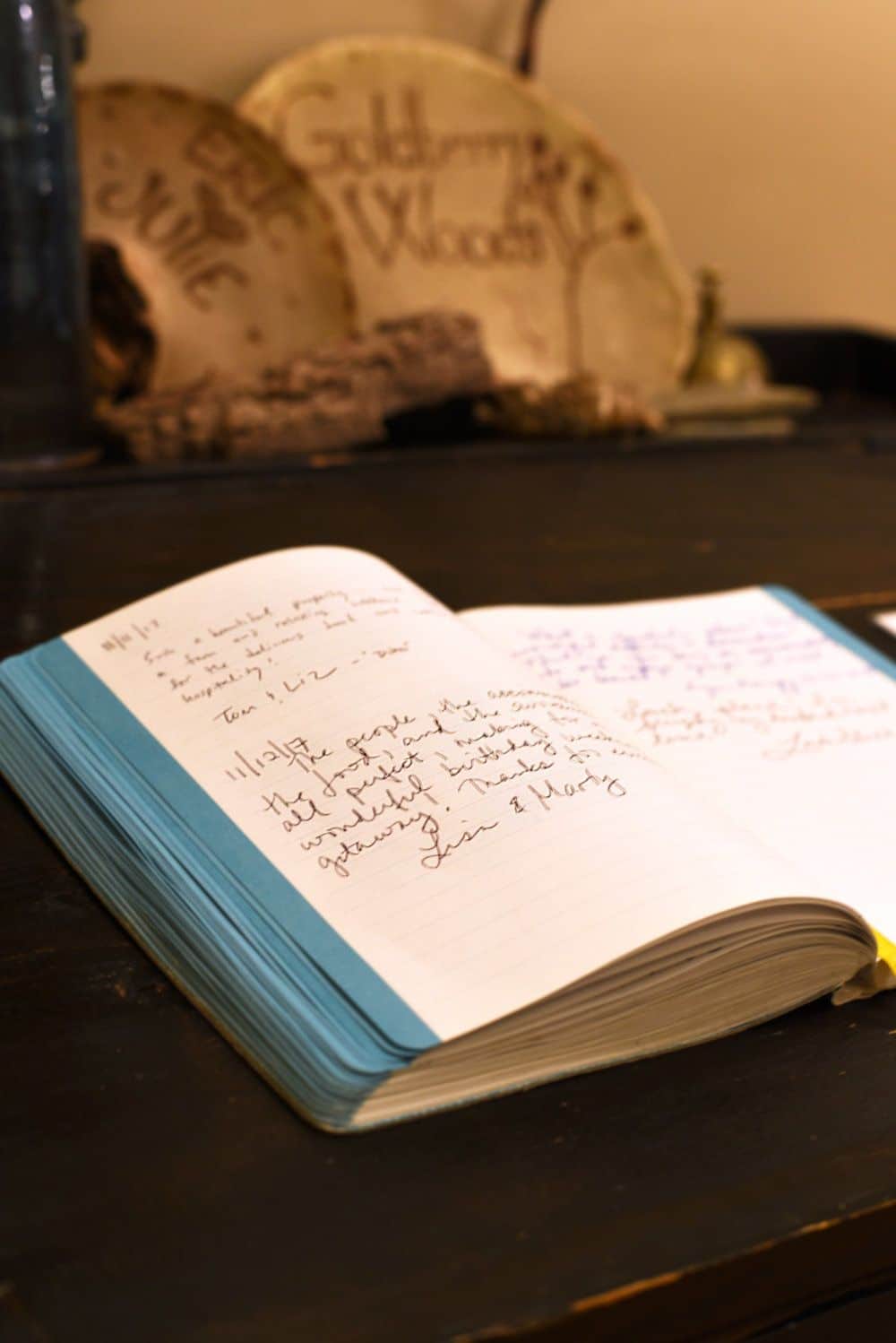 Messages from previous guests are left in the notebook that is pictured.