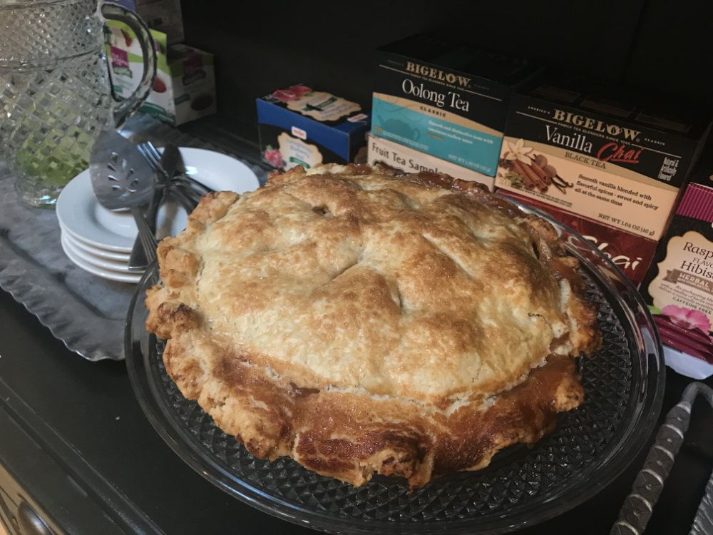 A fresh homemade apple pie ready for guests to enjoy.