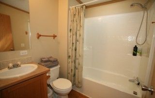Secondary bathroom includes shower/tub, sink, and toilet.