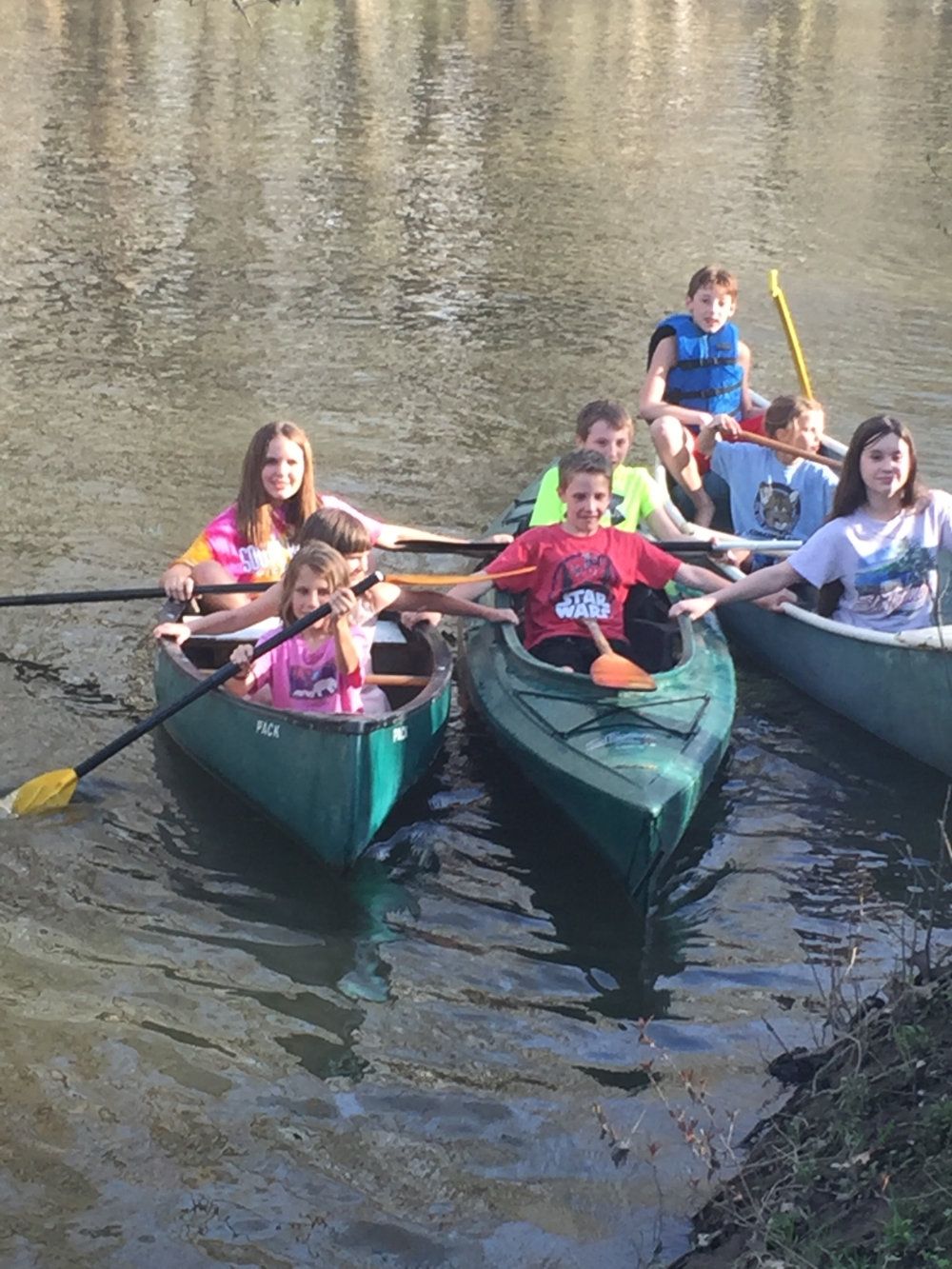 Kids pile into canoes to explore the Galien River.