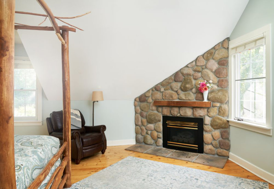 Golden Maple's stone fireplace and leather recliner