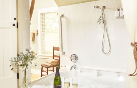 Double jacuzzi bubble bath which opens to the room with local champagne, glasses, towel, and home grown flower bouquet.