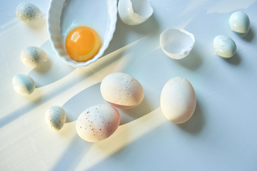 Three chicken eggs and seven quail eggs, produced by Goldberry's birds.