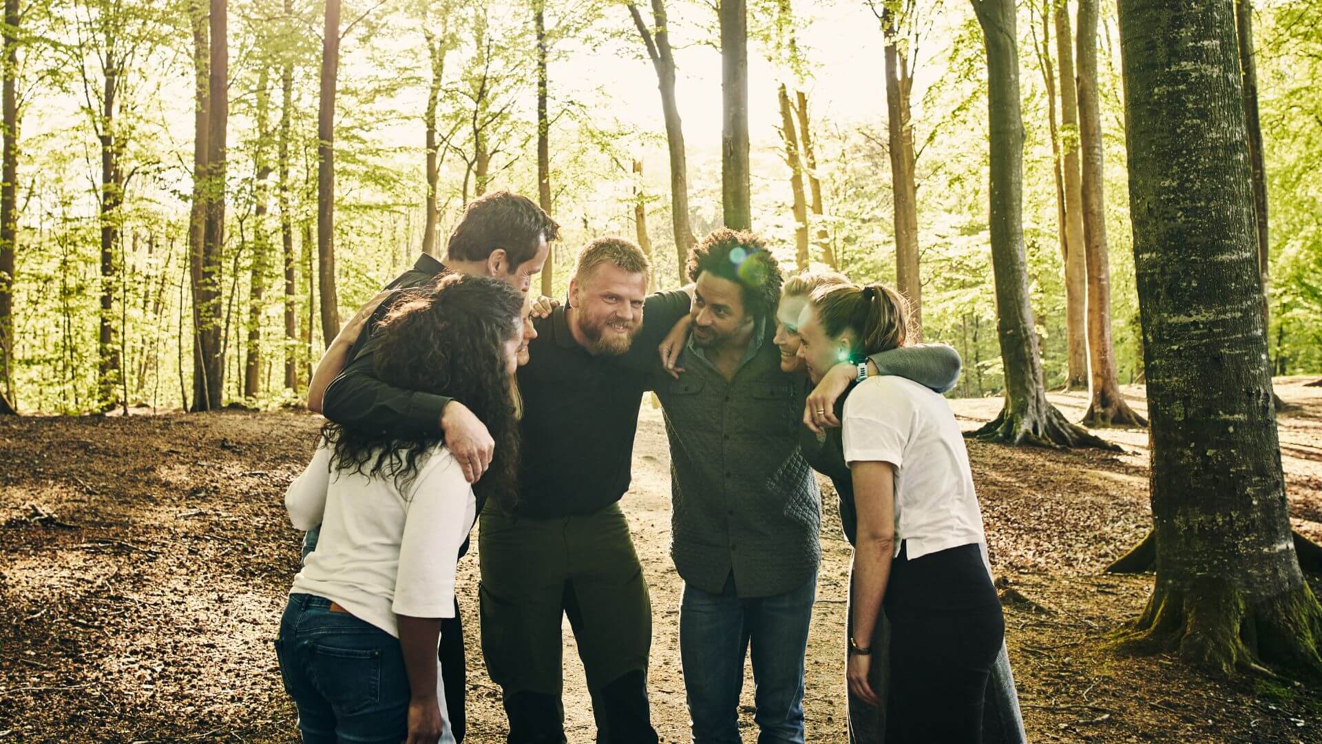 team huddle in the woods during a corporate retreat