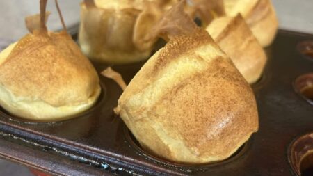 Fresh popovers in a popover pan and sitting on the counter