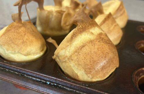 Fresh popovers in a popover pan and sitting on the counter