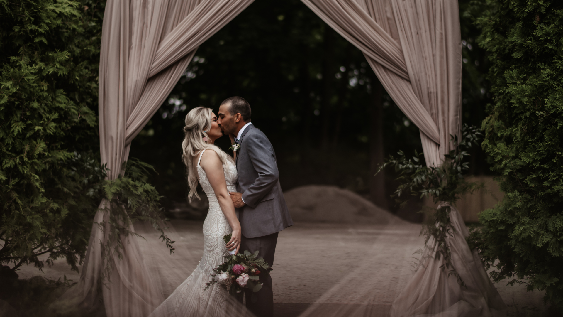 Image of bride and groom kissing at elopement at Goldberry Woods modern farm resort in Harbour County Michigan