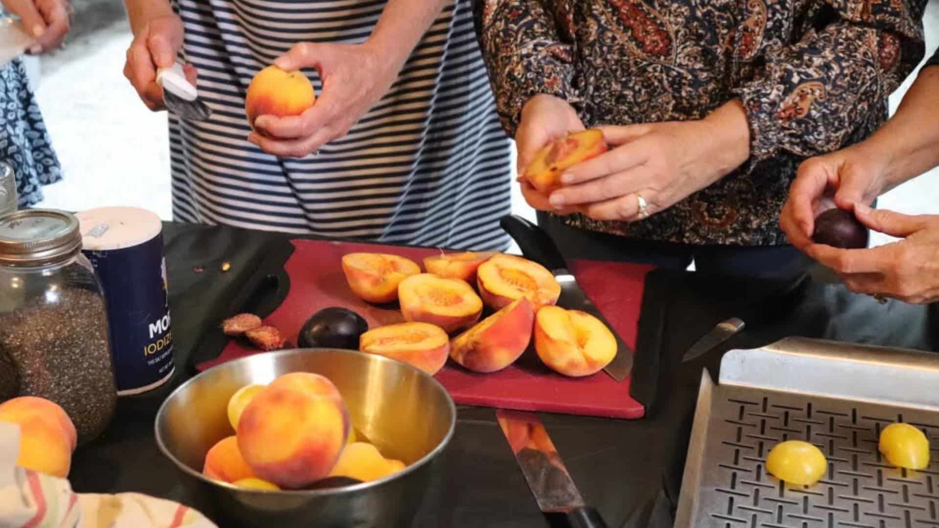 Close up view of peaches being prepared for a dessert