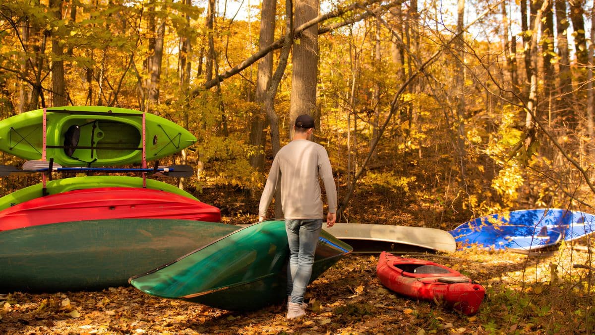 Man grabbing a kayak to explore the Galien River at Goldberry Woods